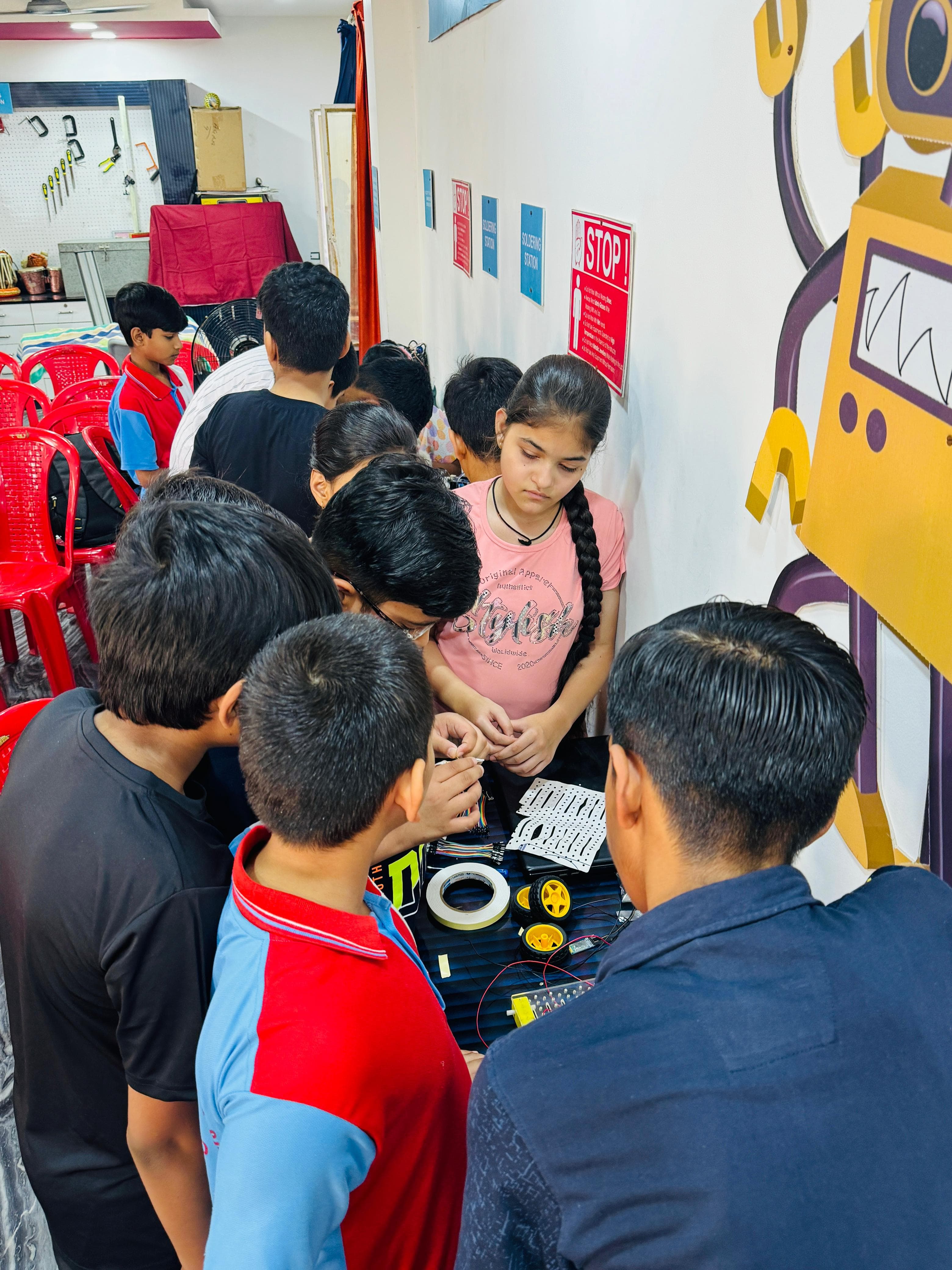 Students learning robotics at Vyomtics workshop