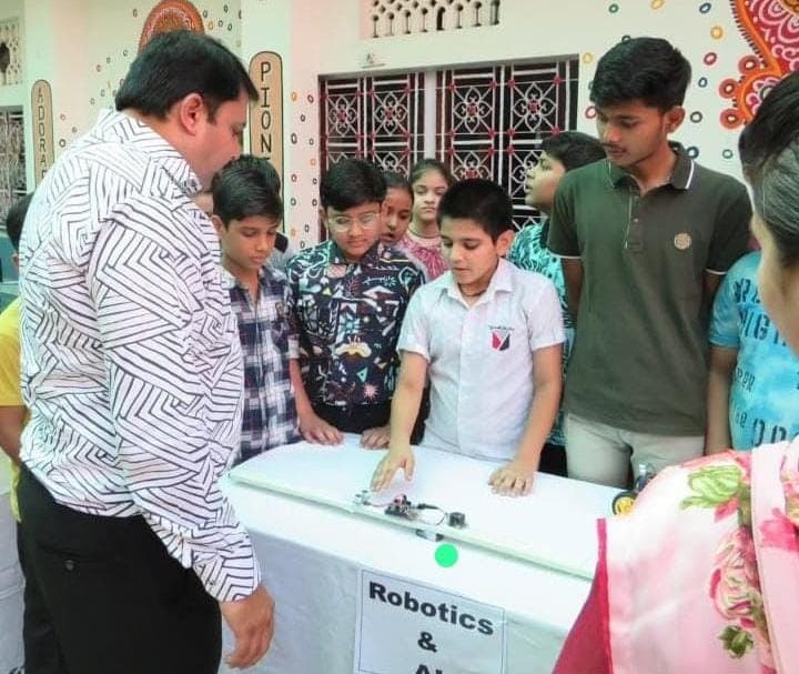 Students engaged in hands-on robotics learning